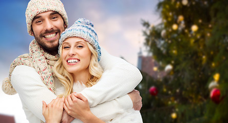 Image showing happy couple hugging over christmas tree