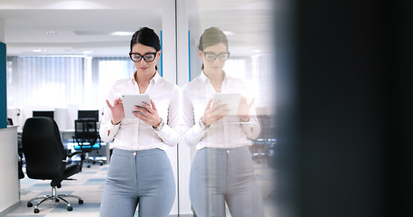 Image showing Business Woman Using Digital Tablet in front of Office