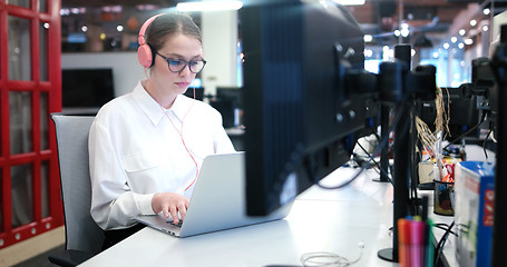 Image showing businesswoman using a laptop in startup office