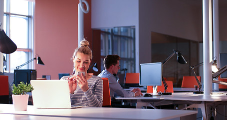 Image showing businesswoman using a laptop in startup office