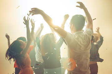 Image showing Nightlife and disco concept. Young people are dancing in club.