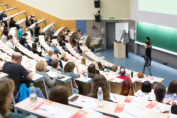 Image showing Expert speaker giving a talk at scientific business conference event.