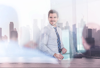 Image showing Confident company leader on business meeting against new york city manhattan buildings and skyscrapers window reflection.