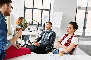 Image showing creative team drinking coffee at office