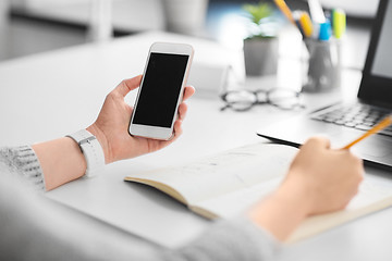 Image showing web designer working on smartphone user interface