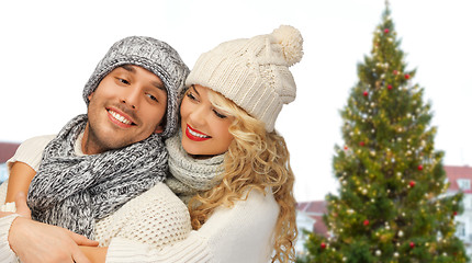 Image showing happy couple hugging over christmas tree