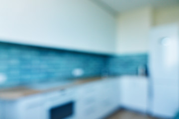 Image showing Blur background, white kitchen with blue ceramic tiles