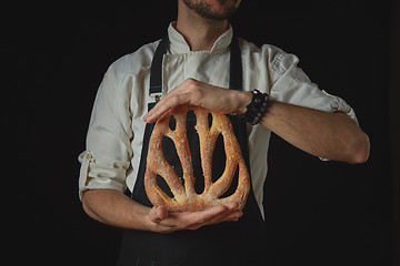 Image showing Hands men holding fougas bread