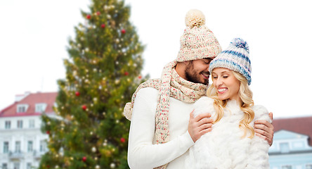 Image showing happy couple hugging over christmas tree