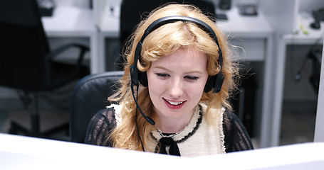 Image showing female call centre operator doing her job