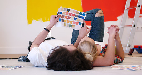 Image showing Happy young couple relaxing after painting