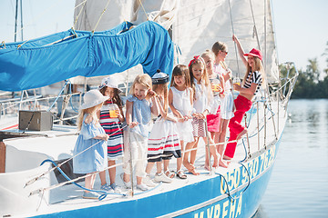 Image showing The children on board of sea yacht