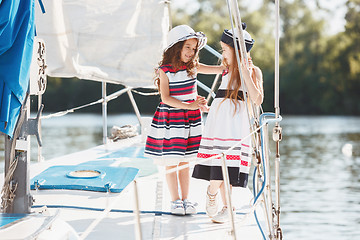 Image showing The children on board of sea yacht