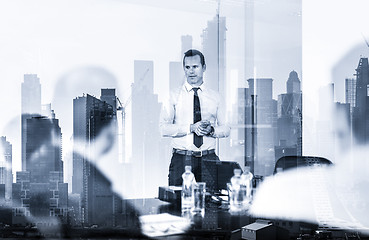 Image showing Confident company leader on business meeting against new york city manhattan buildings and skyscrapers window reflection.