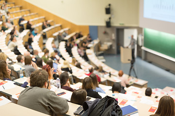 Image showing Expert speaker giving a talk at scientific business conference event.