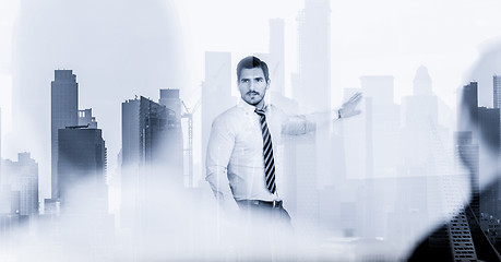 Image showing Confident company leader on business meeting against new york city manhattan buildings and skyscrapers window reflection.