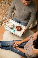 Image showing close up of couple with hot chocolate at home