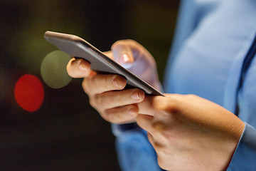 Image showing close up of businesswoman hands with smartphone