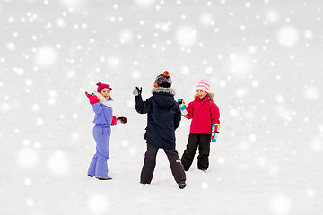 Image showing happy little kids playing outdoors in winter