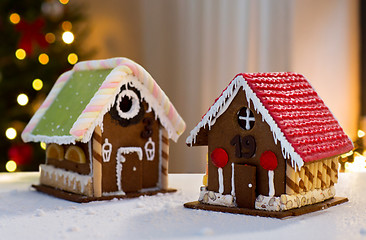 Image showing gingerbread houses over christmas tree lights