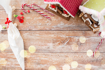 Image showing christmas gingerbread houses on wooden background