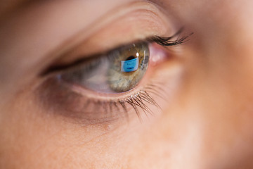 Image showing close up of woman eye looking at computer screen