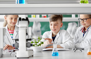 Image showing kids or students with plant at biology class