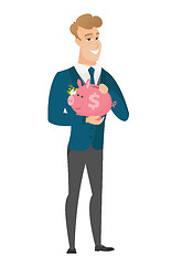 Image showing Caucasian groom holding a piggy bank.