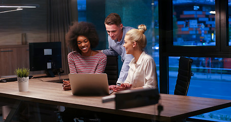 Image showing Multiethnic startup business team in night office