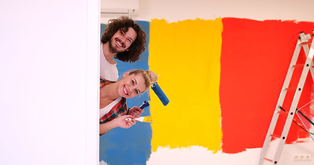 Image showing portrait of a couple painting interior wall