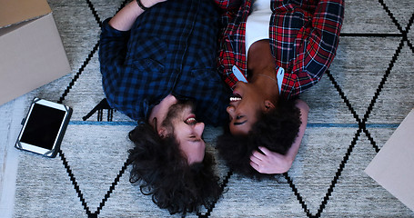 Image showing Top view of attractive young multiethnic couple