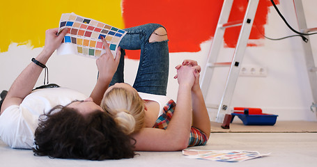 Image showing Happy young couple relaxing after painting