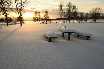 Image showing snow covered table and benches outdoors