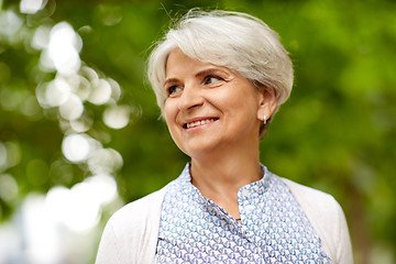 Image showing portrait of happy senior woman at summer park