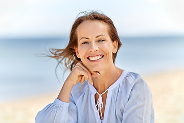 Image showing portrait of happy smiling woman on summer beach