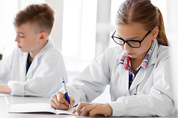 Image showing close up of girl studying chemistry at school