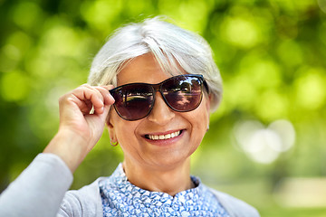 Image showing portrait of happy senior woman at summer park