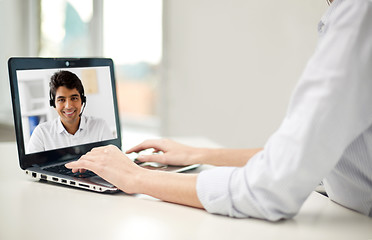 Image showing businesswoman having video call on laptop