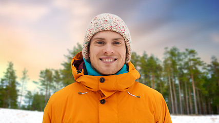 Image showing happy young man in winter clothes outdoors
