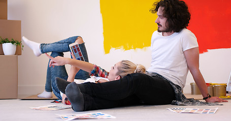 Image showing Happy young couple relaxing after painting