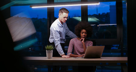 Image showing Multiethnic startup business team in night office