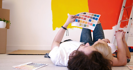 Image showing Happy young couple relaxing after painting