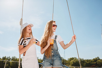 Image showing The children on board of sea yacht