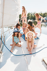 Image showing The children on board of sea yacht