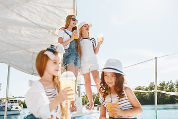 Image showing The children on board of sea yacht