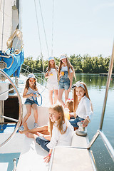 Image showing The children on board of sea yacht