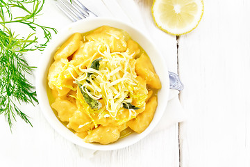 Image showing Gnocchi pumpkin with lemon in bowl on light board top