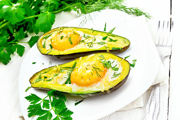 Image showing Scrambled eggs in avocado on white board