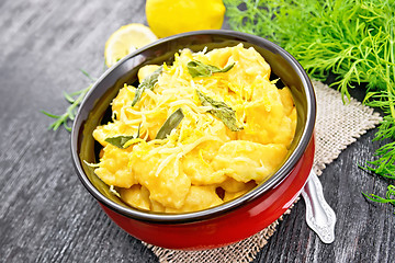 Image showing Gnocchi pumpkin in bowl on dark board