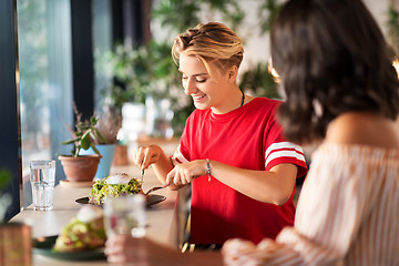 Image showing female friends eating at restaurant